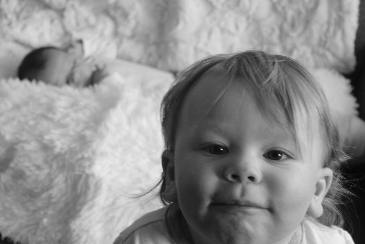 child, childhood, portrait, headshot, real people, cute, one person, innocence, toddler, close-up, babyhood, focus on foreground, baby, looking at camera, young, front view, indoors, lifestyles, girls, human face, softness, mouth open