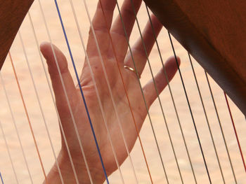 Close-up of hand on musical instrument