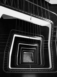 Directly below shot of spiral staircase of building