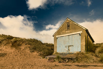 House on field against sky