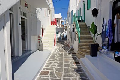 Sidewalk amidst buildings in city