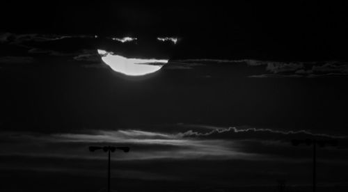 Low angle view of cloudy sky at night