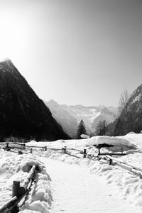 Scenic view of snow covered mountains against sky