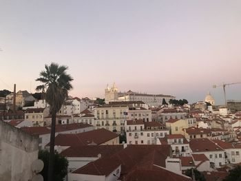 Buildings in city against clear sky