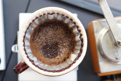 High angle view of coffee cup on table