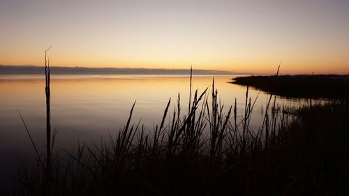 Scenic view of lake during sunset