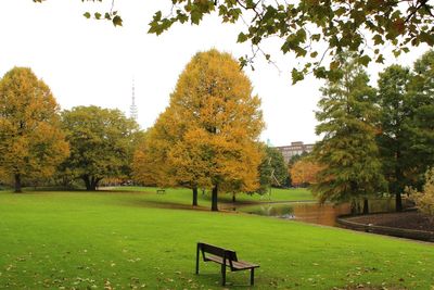 Trees in park against sky during autumn