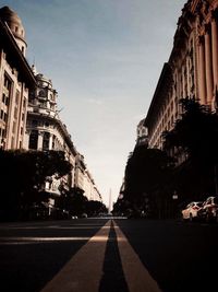 City street against cloudy sky