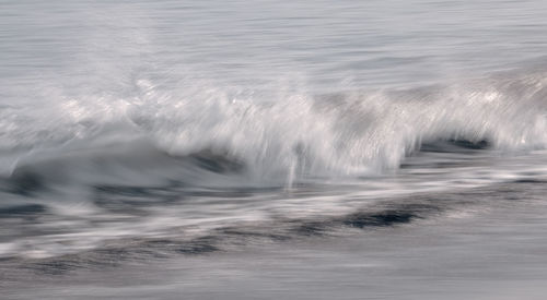 Wave landing at arrieta beach, lanzarote