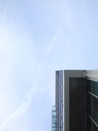 Low angle view of building against cloudy sky