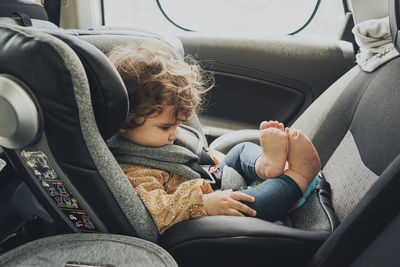 Boy sitting in car