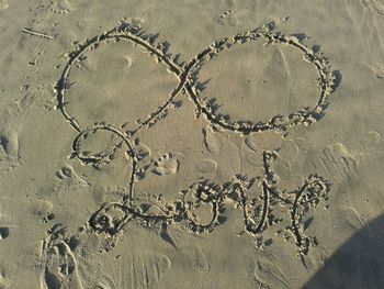 Close-up of chain on sand