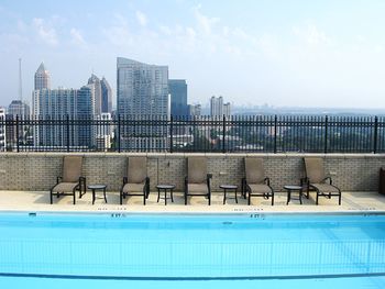 Swimming pool against buildings in city