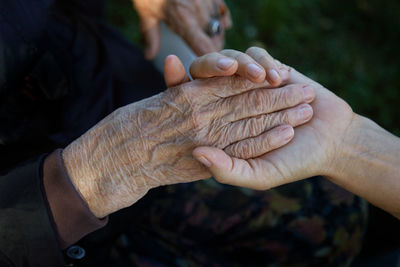 Close-up of hand holding hands