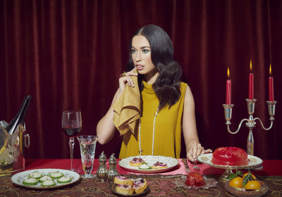 Young woman sitting on table