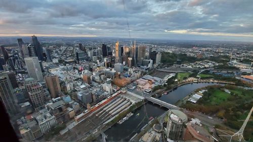 High angle view of modern buildings in city against sky