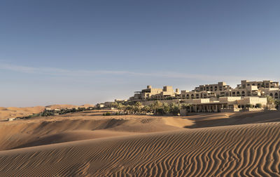 Scenic view of desert against clear sky