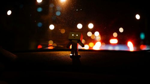 View of illuminated road at night