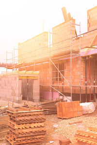 Construction site in city against clear sky