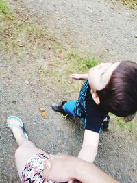 High angle view of girl lying on land