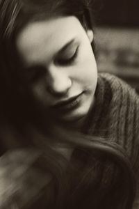 Close-up of young woman with eyes closed