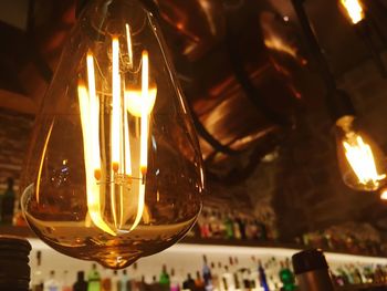 Close-up of illuminated light bulb
