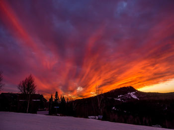 Scenic view of dramatic sky during sunset