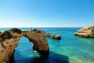 Scenic view of sea against clear blue sky