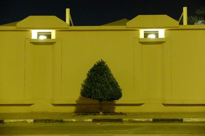 Yellow lamp in front of building