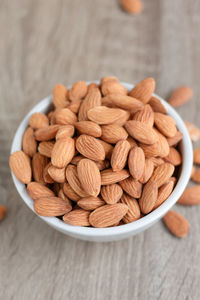 High angle view of nuts in bowl on table