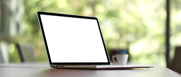 Close-up of laptop on table