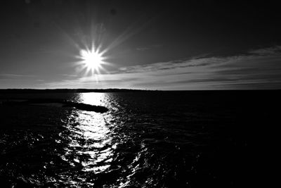 Sun shining over river