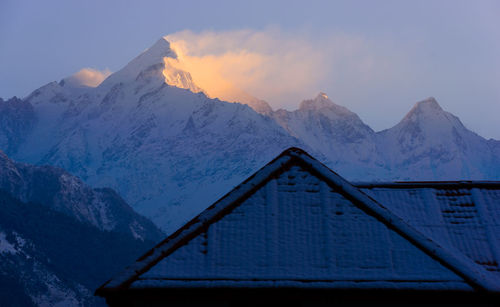 Scenic view of snowcapped mountains against sky