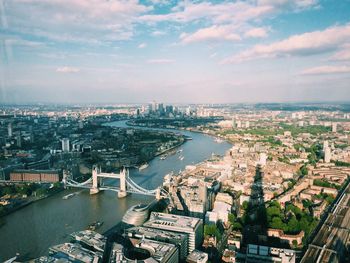 High angle view of city against cloudy sky