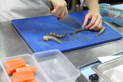 High angle view of person preparing food on table