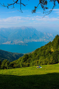 Scenic view of landscape and mountains against sky