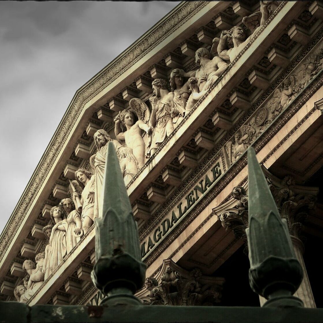 low angle view, architecture, built structure, building exterior, railing, sky, metal, place of worship, day, architectural column, in a row, steps, religion, spirituality, roof, outdoors, famous place, steps and staircases, staircase, no people