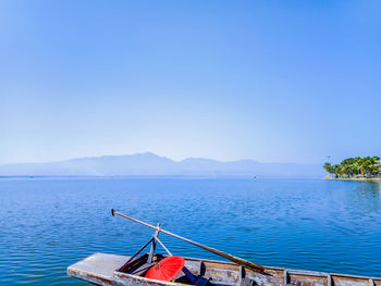 Scenic view of sea against clear blue sky