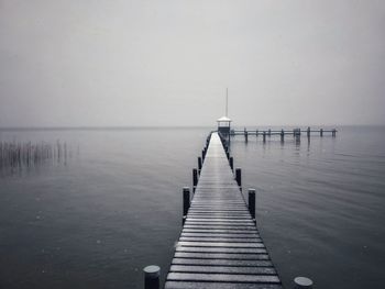 Snowflakes on winter lake