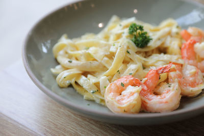 Close-up of noodles served in plate on table