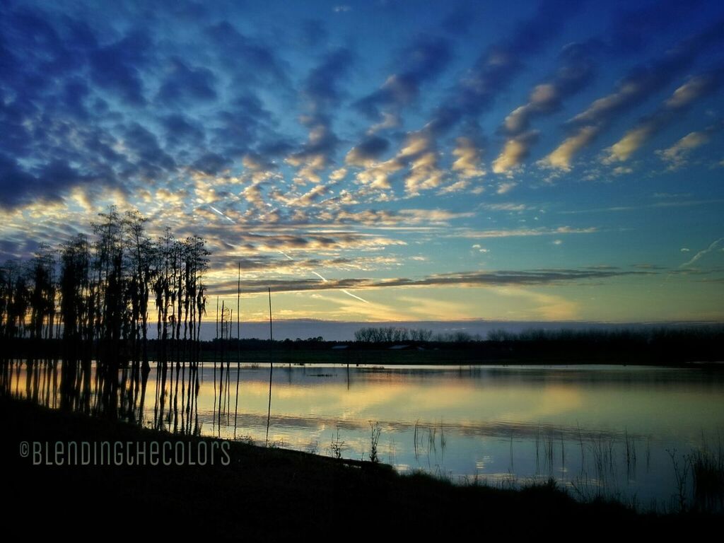 water, sky, tranquility, tranquil scene, sunset, scenics, silhouette, beauty in nature, cloud - sky, lake, reflection, nature, electricity pylon, power line, tree, cloudy, cloud, idyllic, weather, river