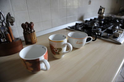 High angle view of coffee cups on table