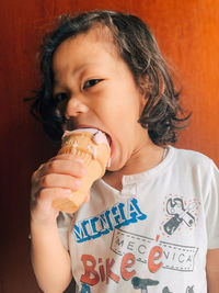 Portrait of a boy holding ice cream