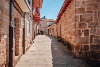 Narrow alley along buildings