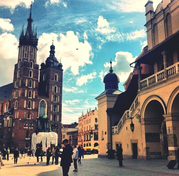 architecture, building exterior, built structure, sky, men, person, street, walking, lifestyles, large group of people, church, cloud - sky, city, religion, cloud, travel destinations, old town, city life, arch