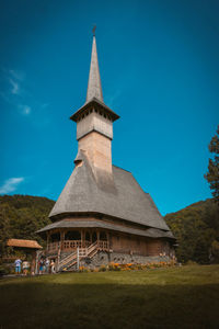 Low angle view of built structure against blue sky