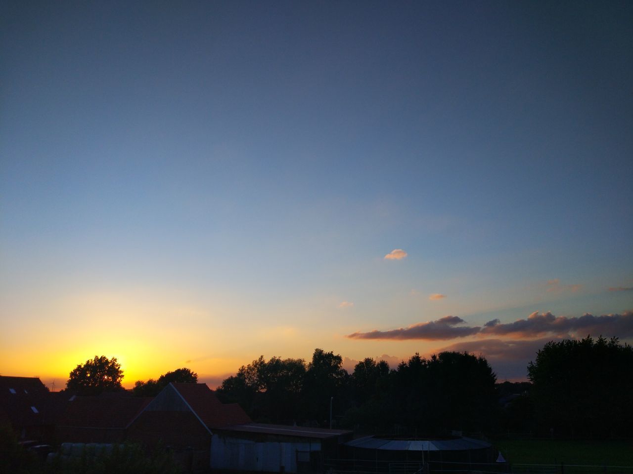 SILHOUETTE HOUSE AGAINST SKY DURING SUNSET