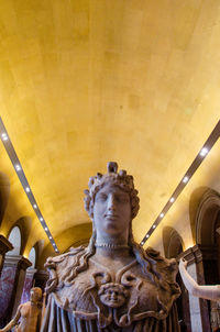 Low angle view of statue against building