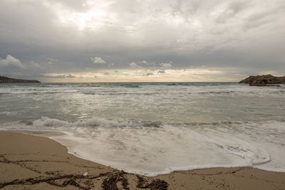 Scenic view of beach against sky during sunset