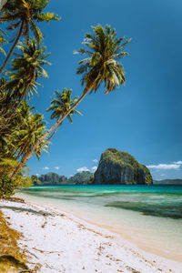 Scenic view of sea against blue sky